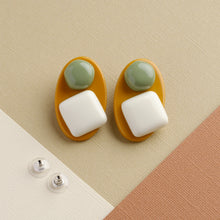 Load image into Gallery viewer, NINI WEAR matcha green and white handmade earrings on light brown background
